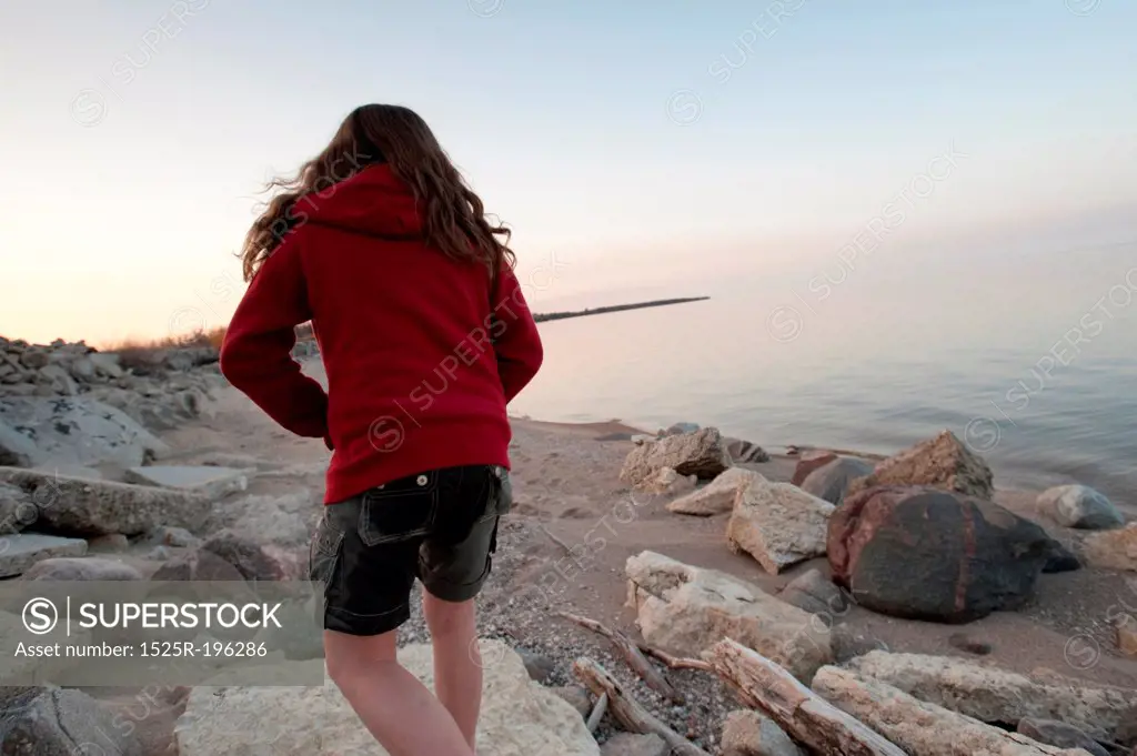 Girl along shoreline in Gimli, Manitoba, Canada