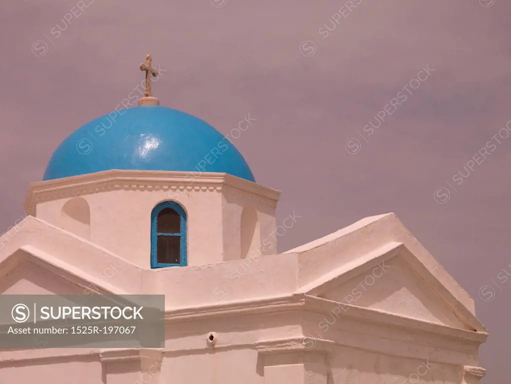 Crucifix on top of dome in Mykonos Greece