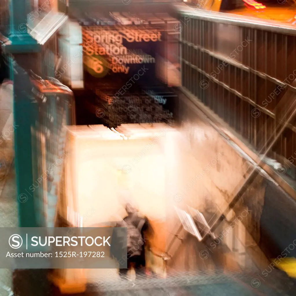 Blurred image of a man coming up the stairsway from the subway in Manhattan, New York City, U.S.A.