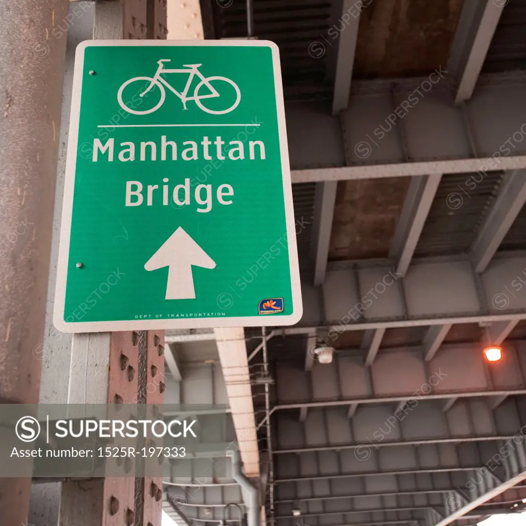 Bicycle lane direction sign to the Manhattan Bridge in Manhattan, New York City, U.S.A.