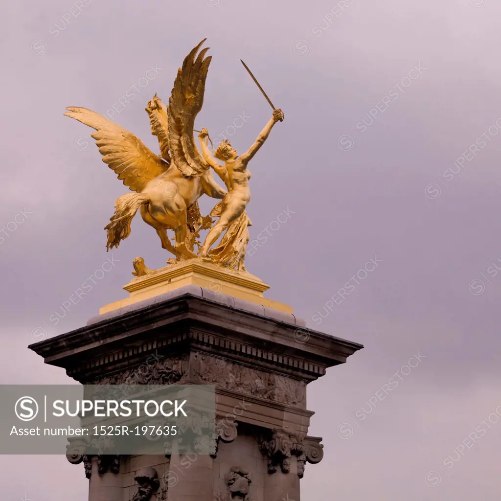 Golden statue on the Ponte Alexandre III Bridge in Paris France