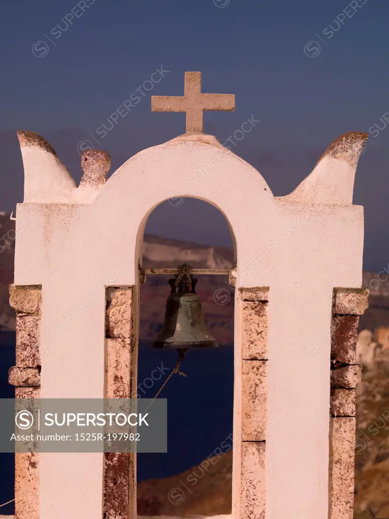 Bell and Crucifix on church in Santorini Greece