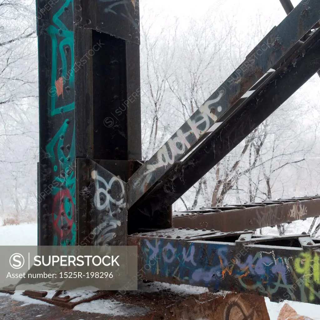 Graffiti on steel post with snow