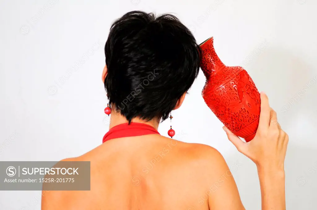 A woman with a red vase