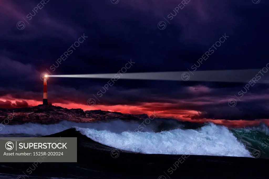 Lighthouse on the rocks in storm ocean