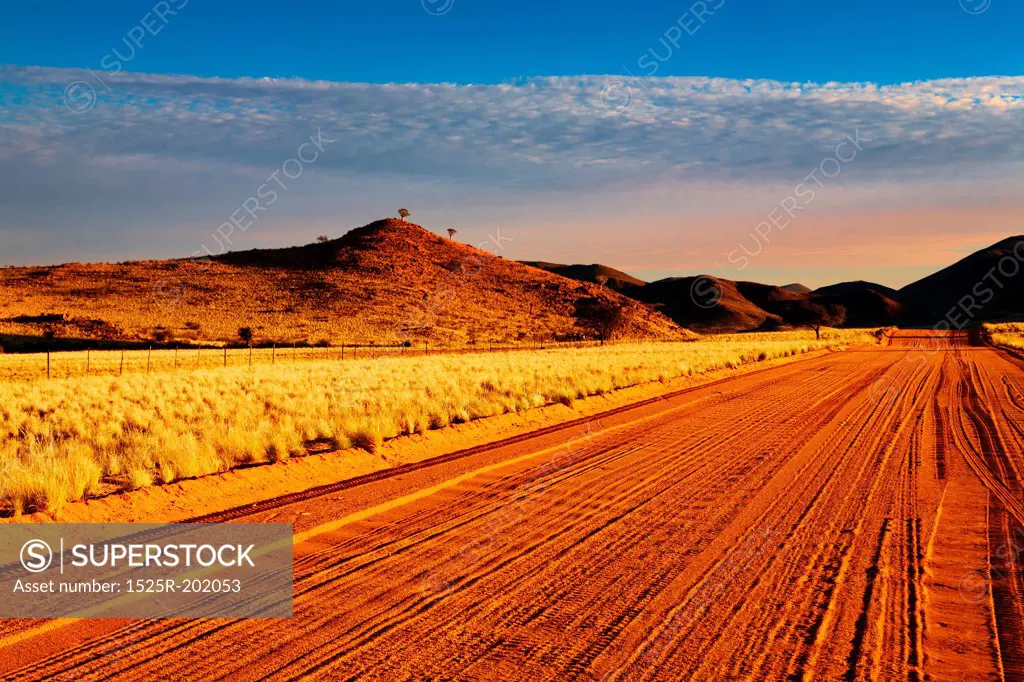 Road in Kalahari Desert at sunset, Namibia