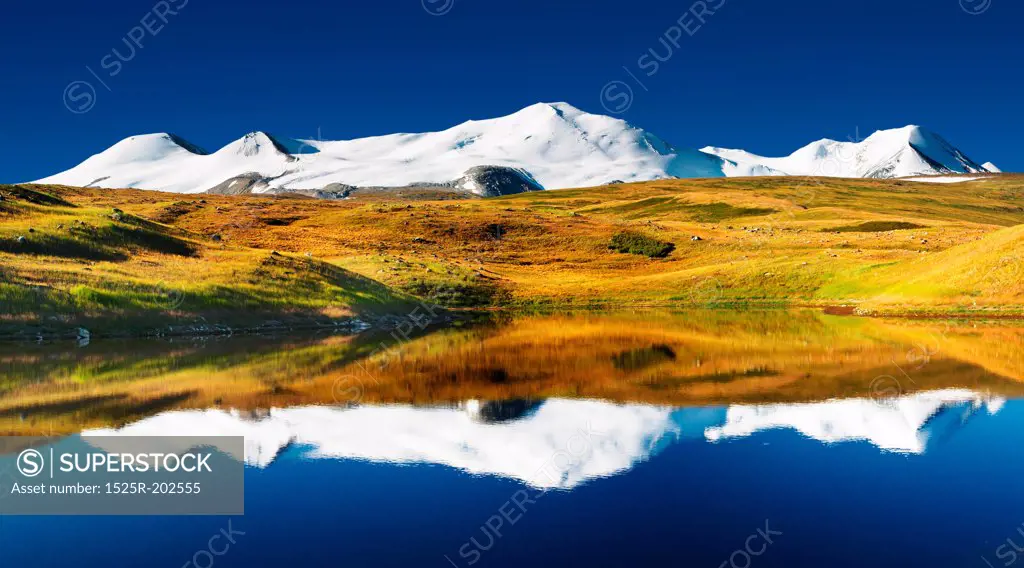 Landscape with lake and snowy mountains