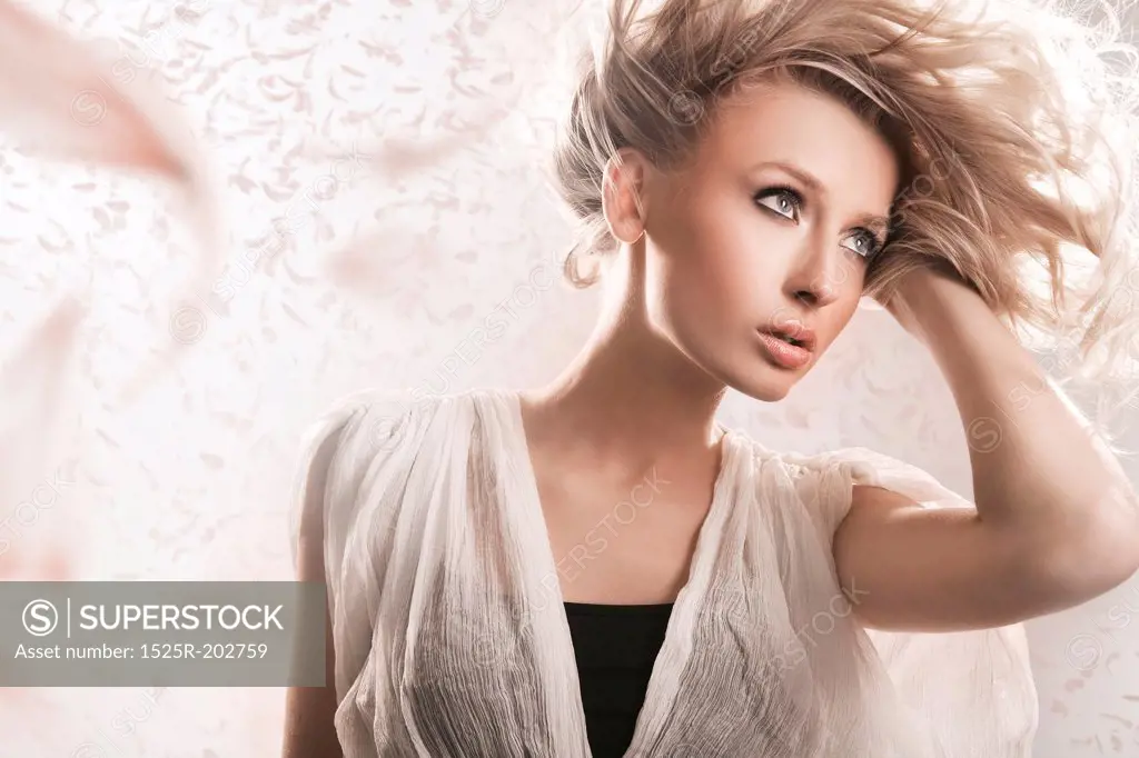 Young blond beauty with creativity hairstyle