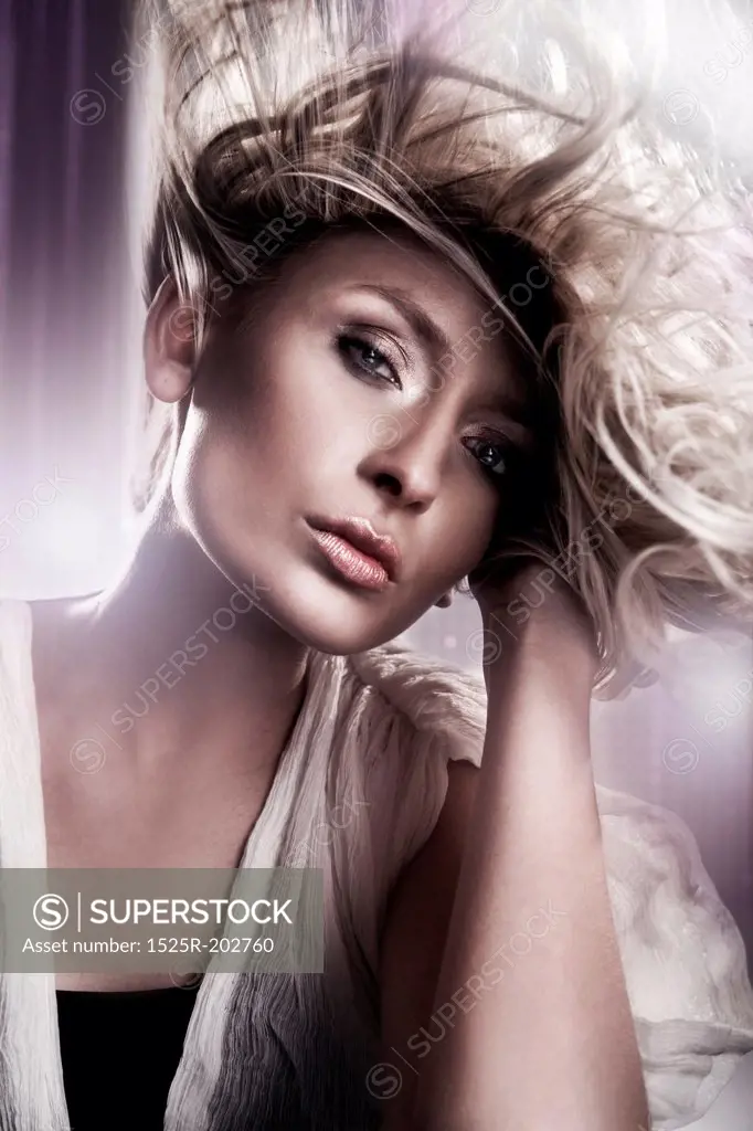 Young blond beauty with creativity hairstyle
