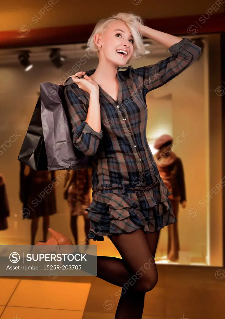Happy young woman shopping