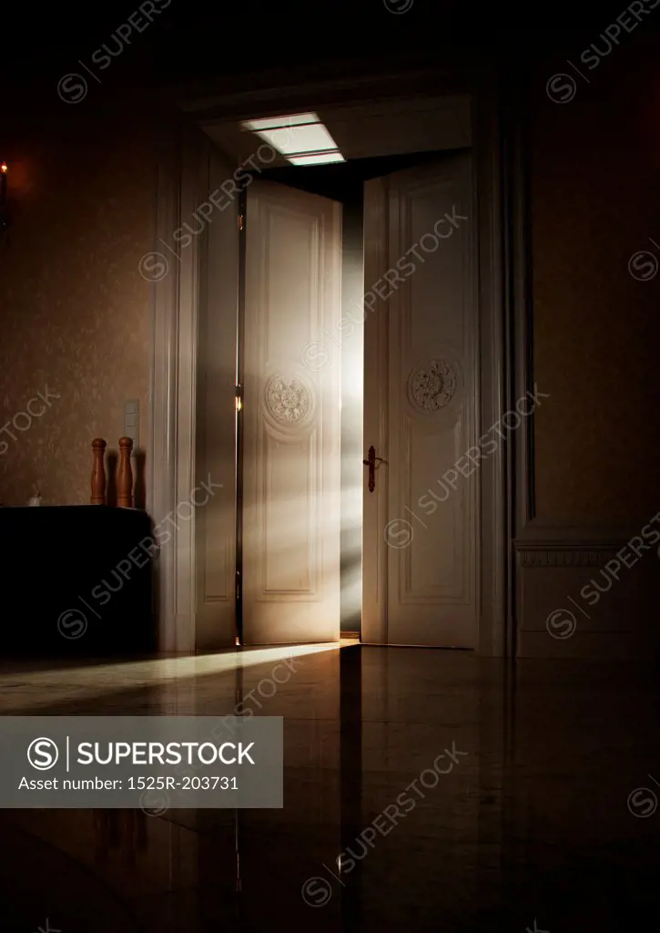 Mysterious rays of light behind door