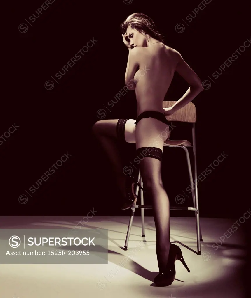 Attractive young woman on the chair