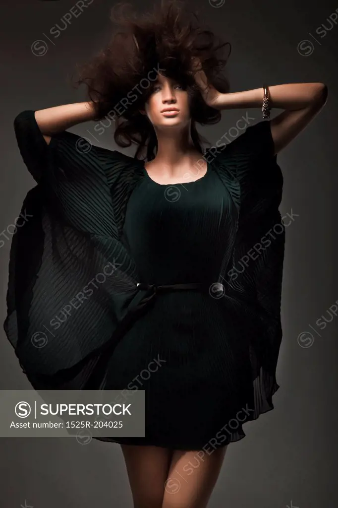 Vogue style studio shot of a young woman