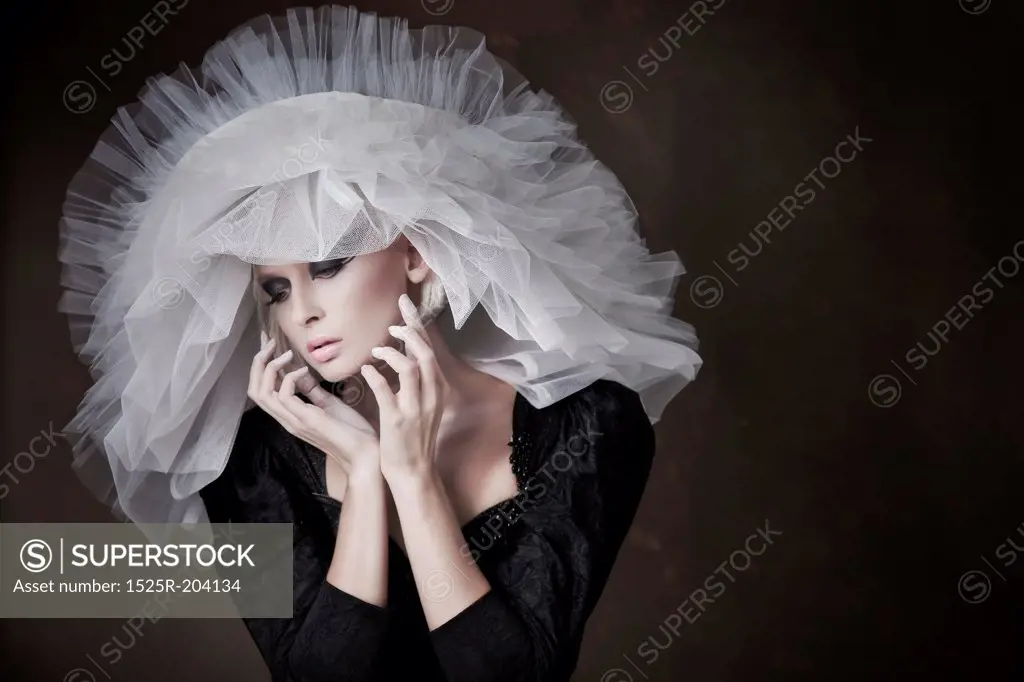Great portrait of pretty young blonde with white hat