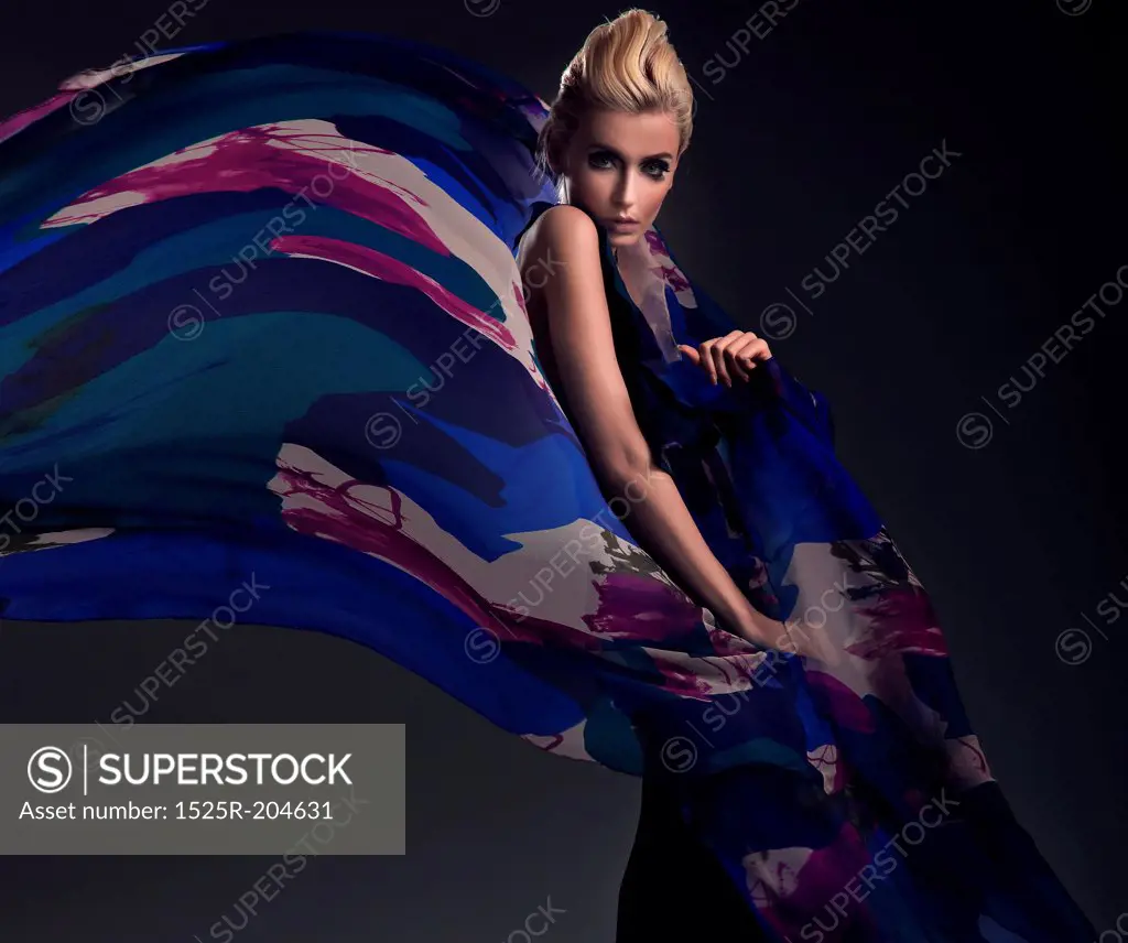 Romantic photo of a blonde wearing colorful dress