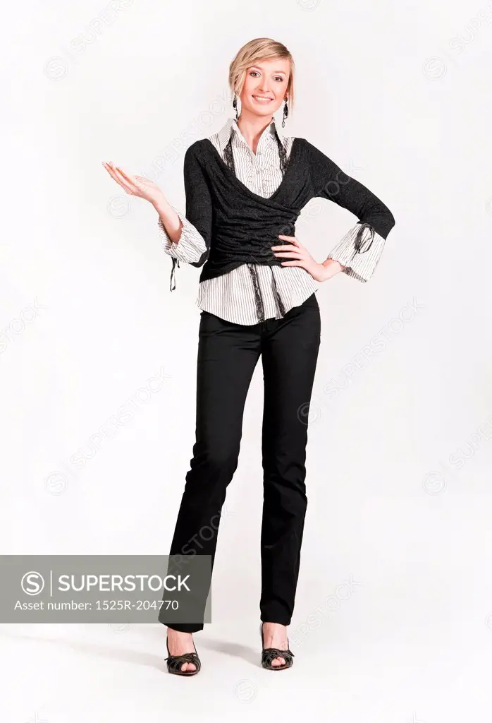 Young happy businesswoman standing