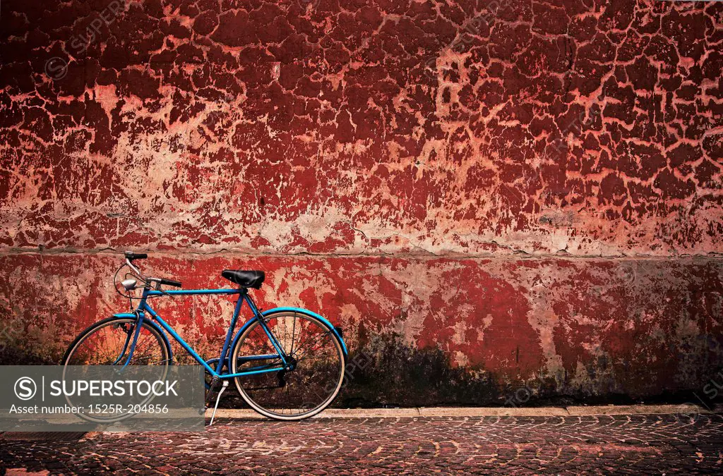 Old retro bicycle over grungy wall