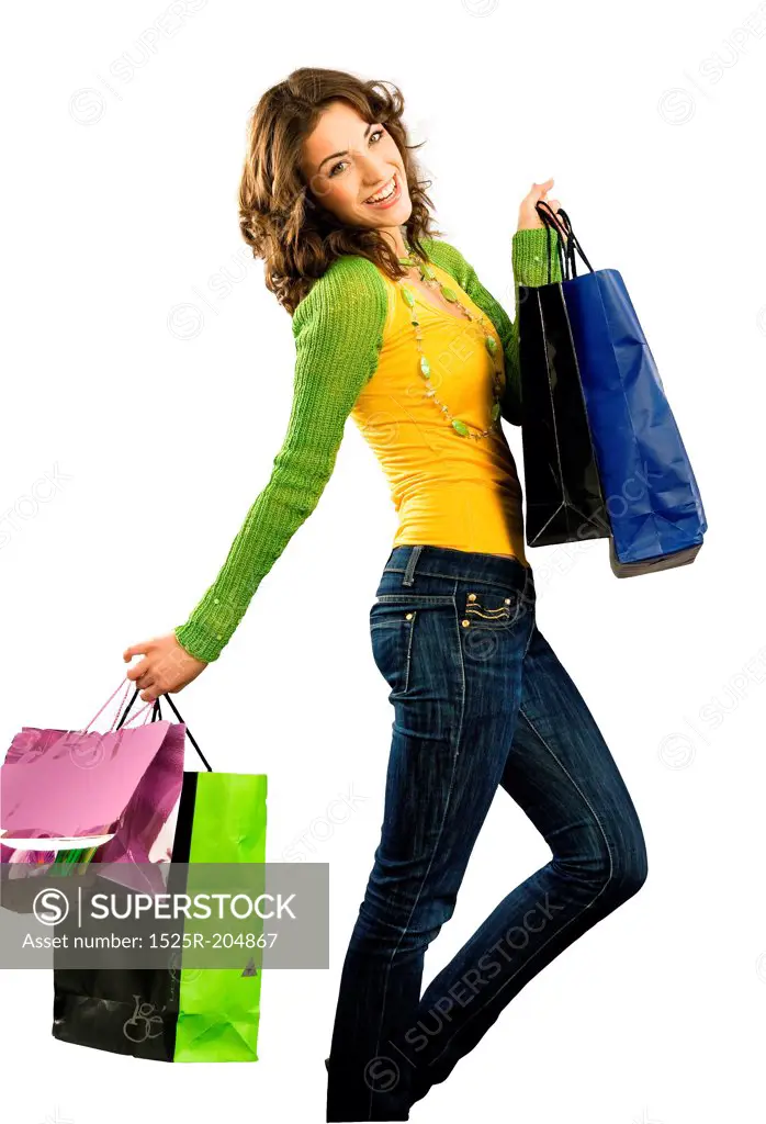 Cute happy girl with shoppingbag isolated on white