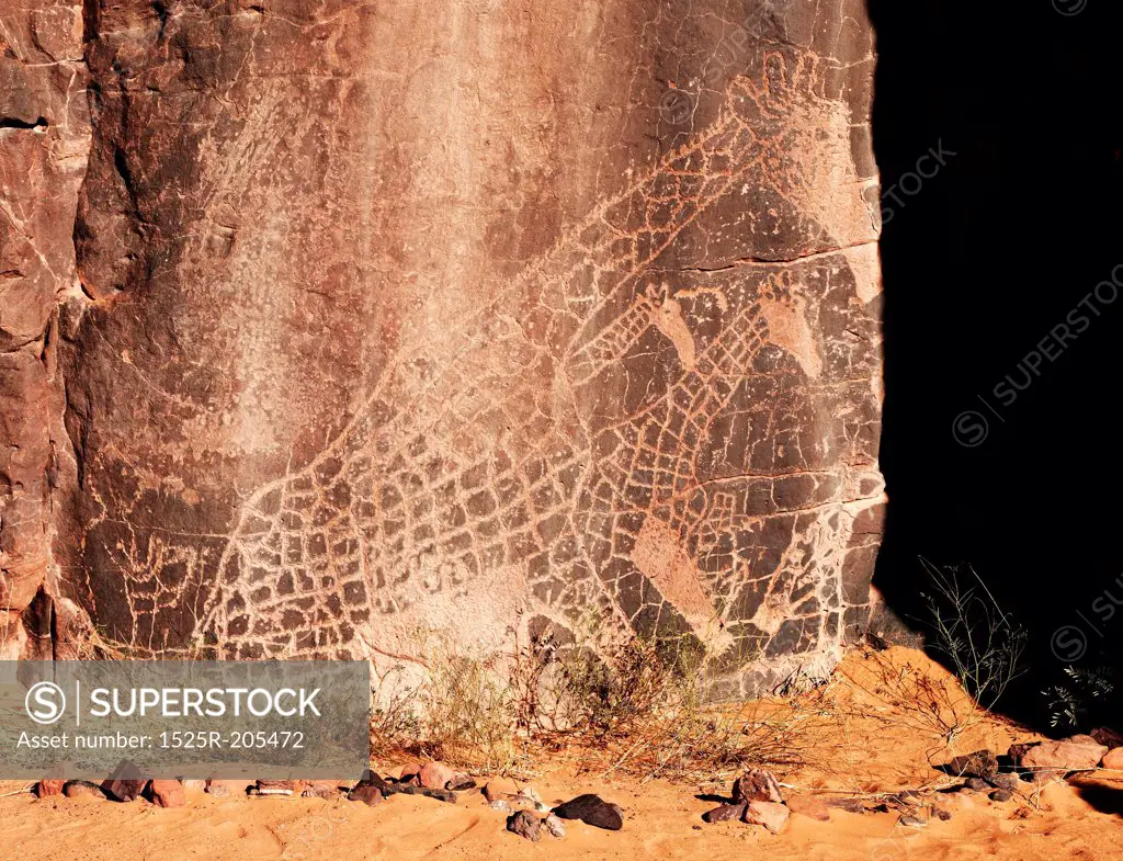 Ancient rock engraving in Sahara Desert, Tadrart, Algeria