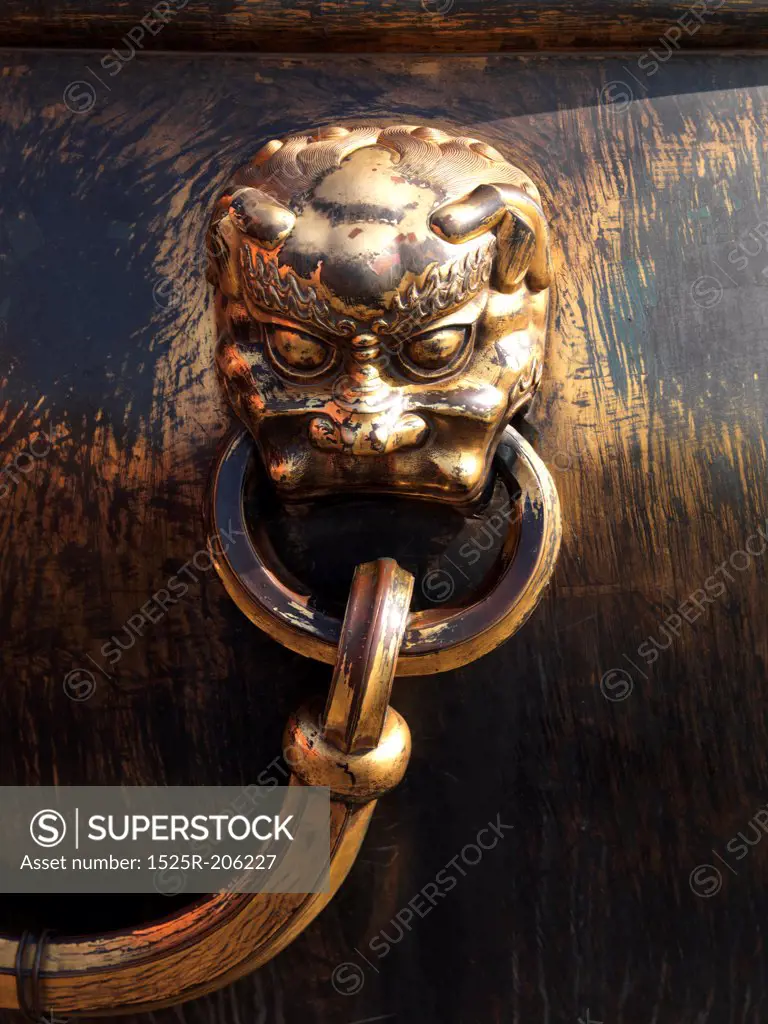 Lion handle on a bronze urn at the Forbidden City, Beijing, China