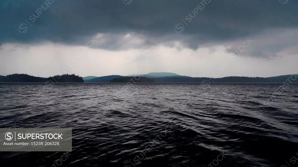 Daunting deep stormy lake and clouds.