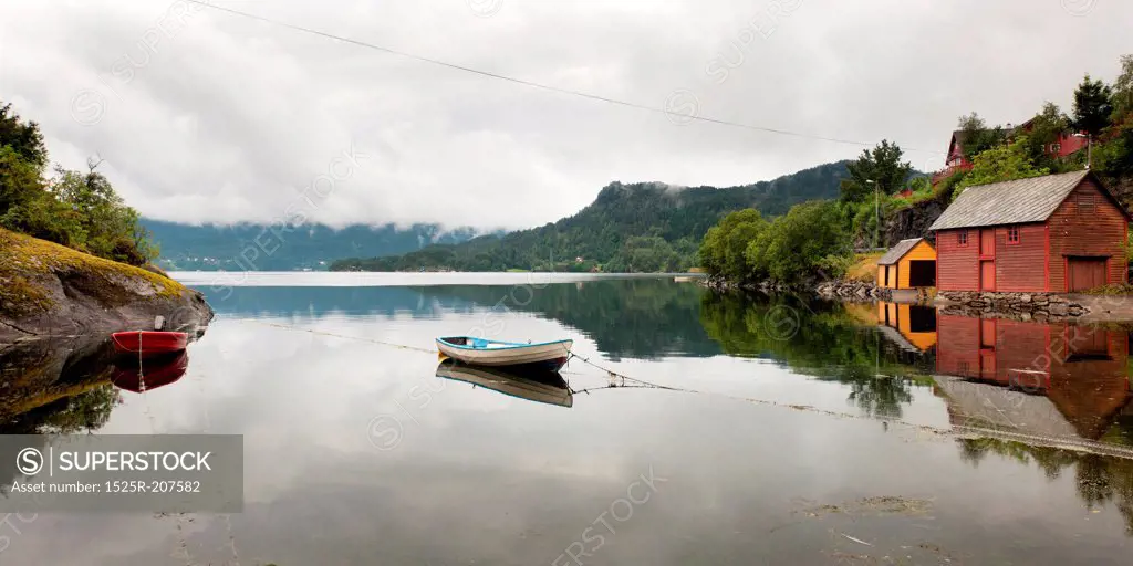 Reflection of a boat in water, Bjorn Fjord, Hardangervidda, Hardanger, Norway