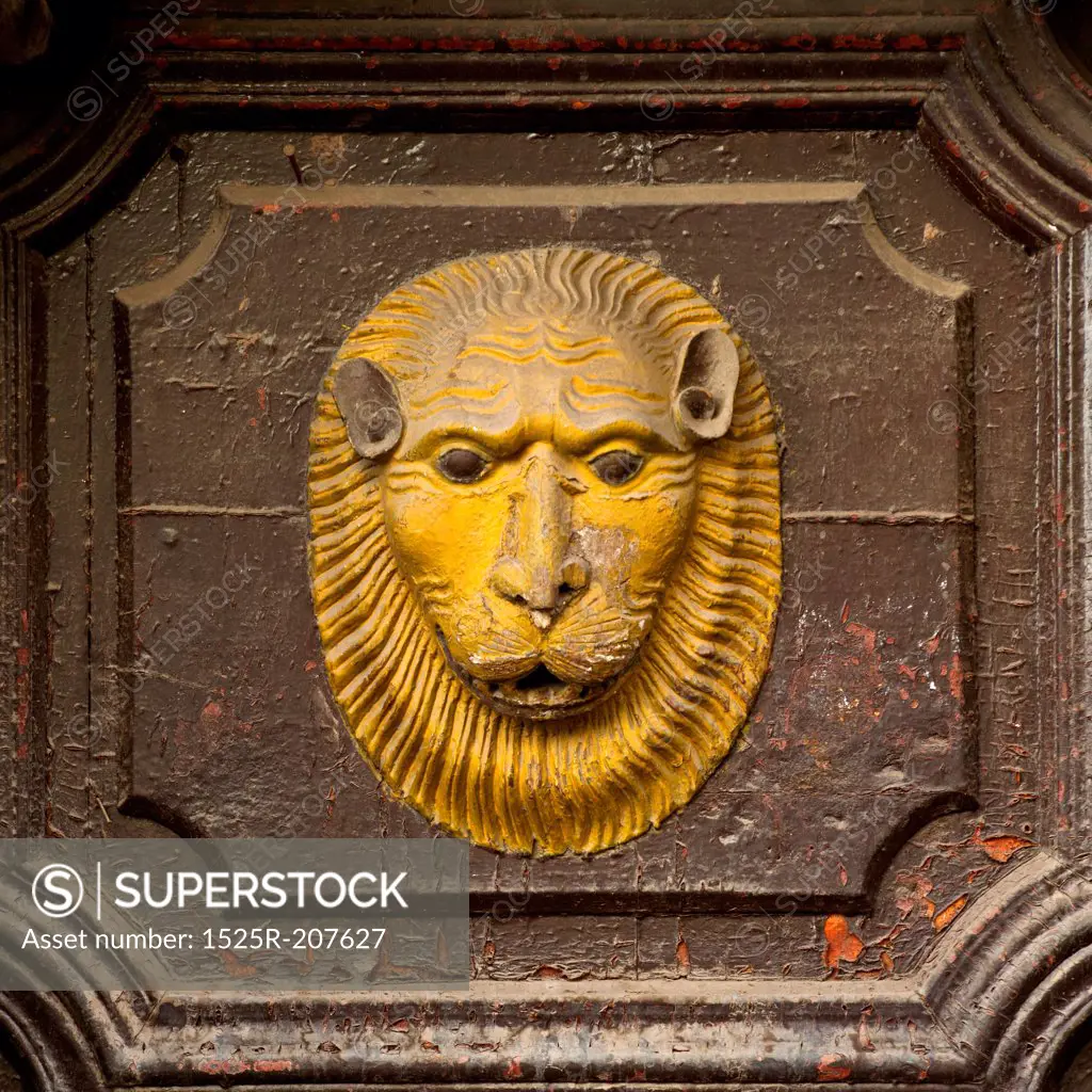 Lion's face carved on a door, Cuzco, Peru