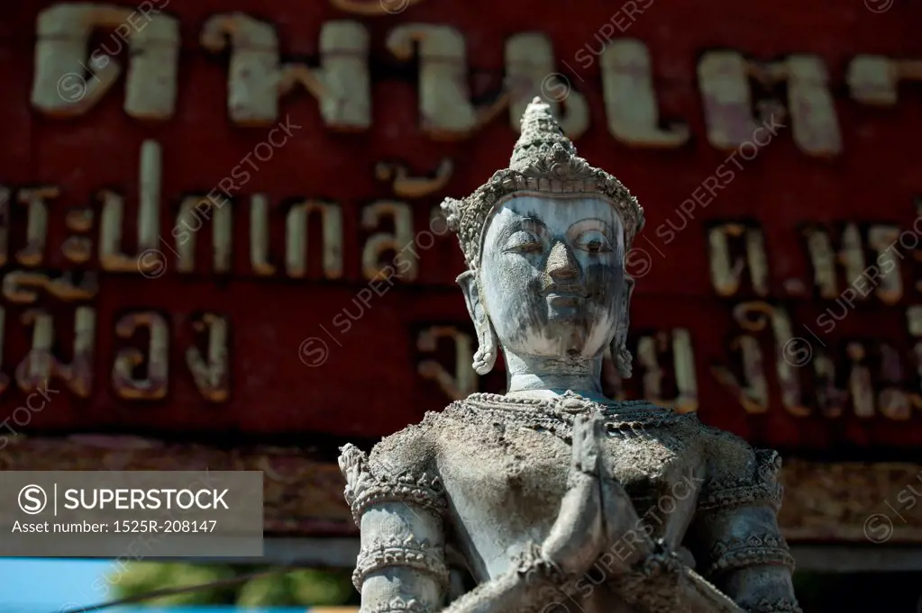 Close-up of a statue of an Apsara at Wat Phra Singh, Chiang Mai, Thailand
