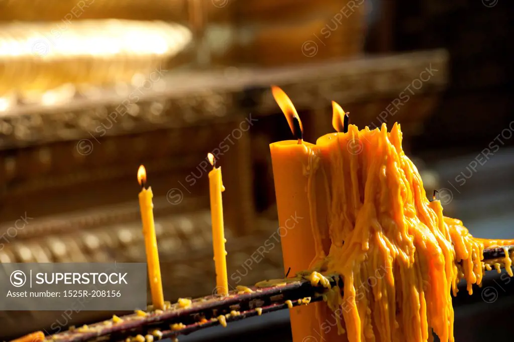 Burning candles in a Pra Thad Doi Suthep Pagoda temple, Wat Phrathat Doi Suthep, Chiang Mai, Thailand