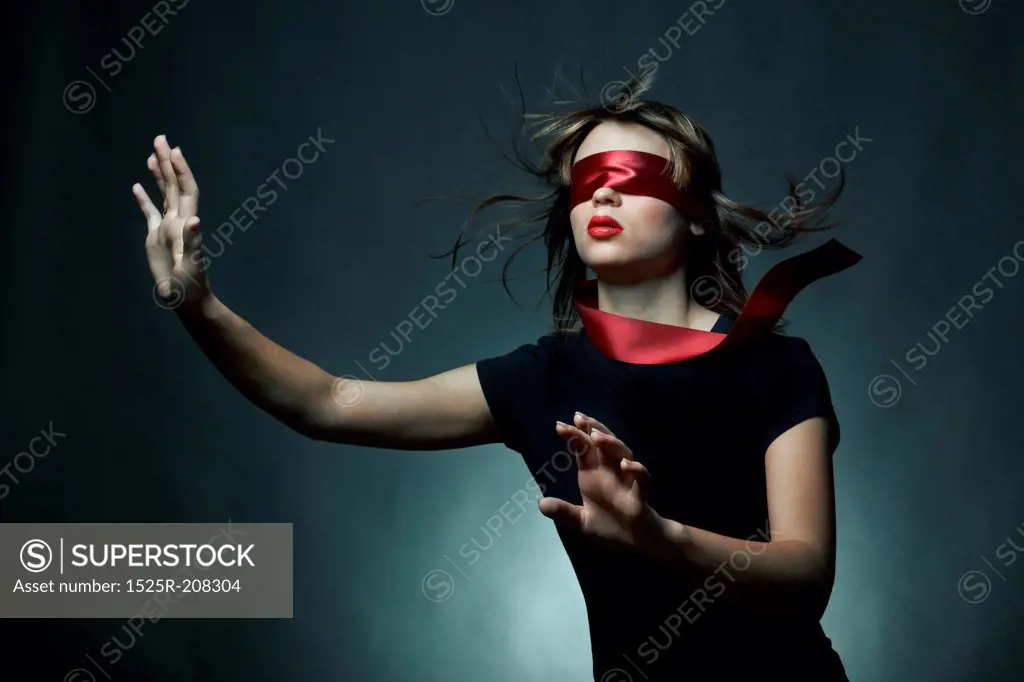 Portrait of the young woman blindfold