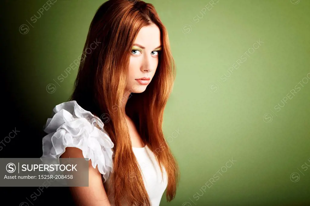 Fashion photo of a young woman with red hair