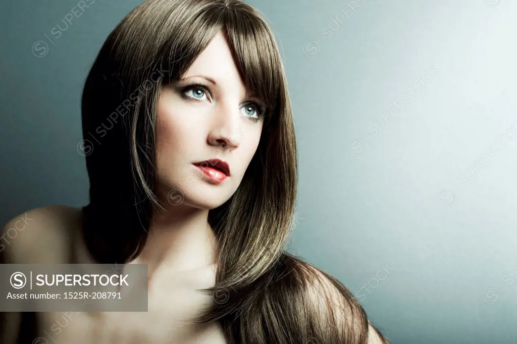 The young sexy girl in chestnut-coloured wig