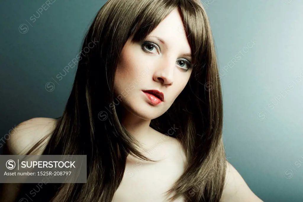 The young sexy girl in chestnut-coloured wig