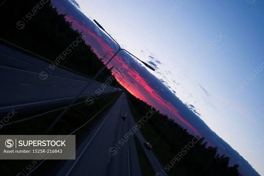 Long road with a red sunset