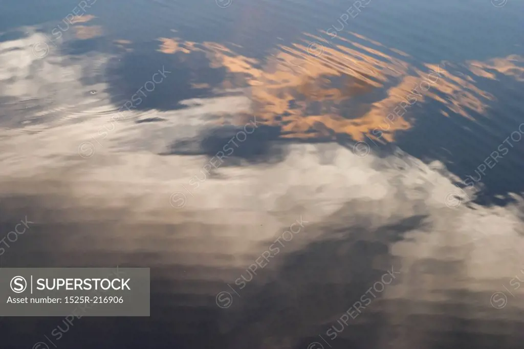 Water ripples with cloud reflections