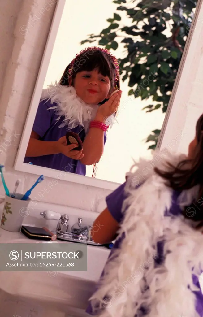 Young girl playing dress-up