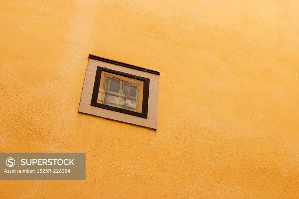 Rectangular window on yellow brick wall