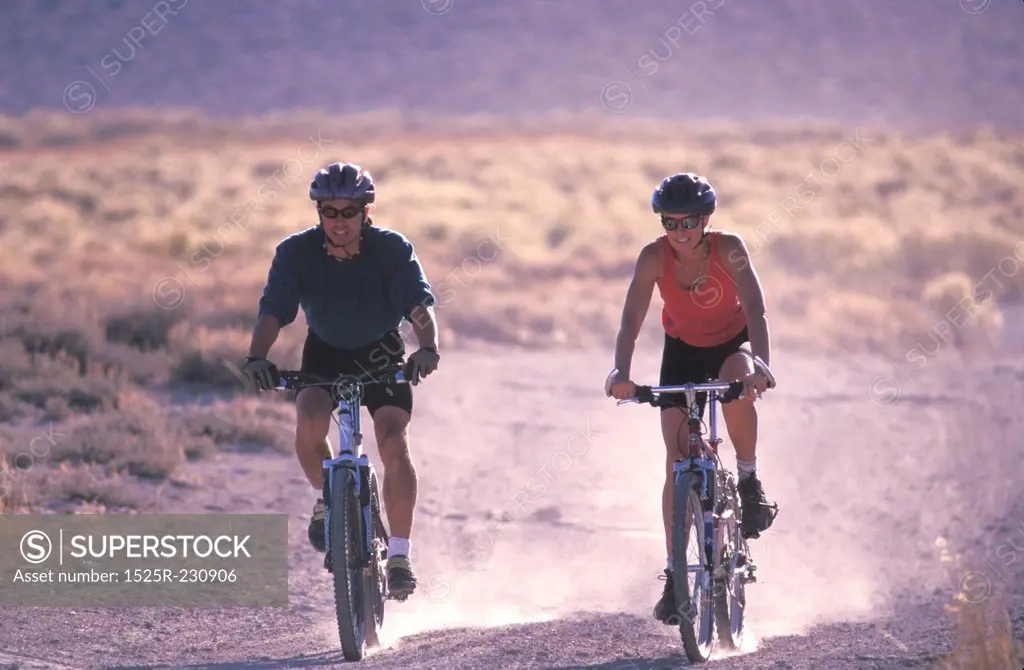 Couple Mountain Biking Together
