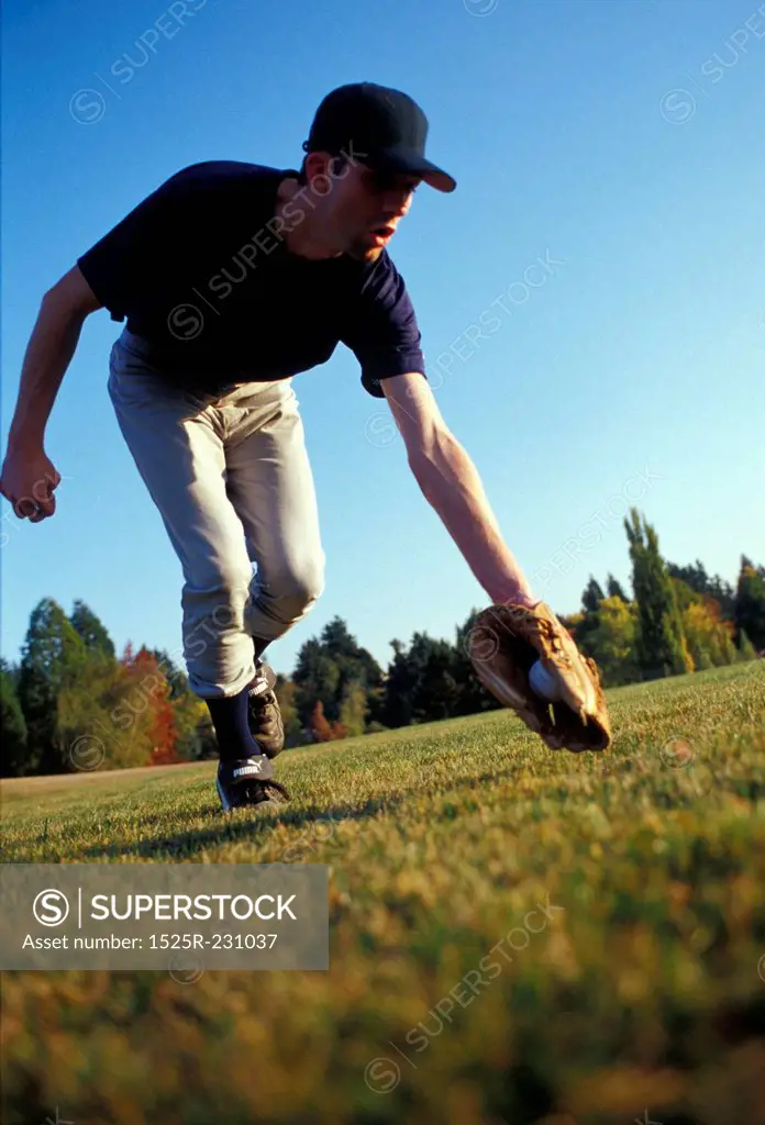 Man Catching a Ground Ball