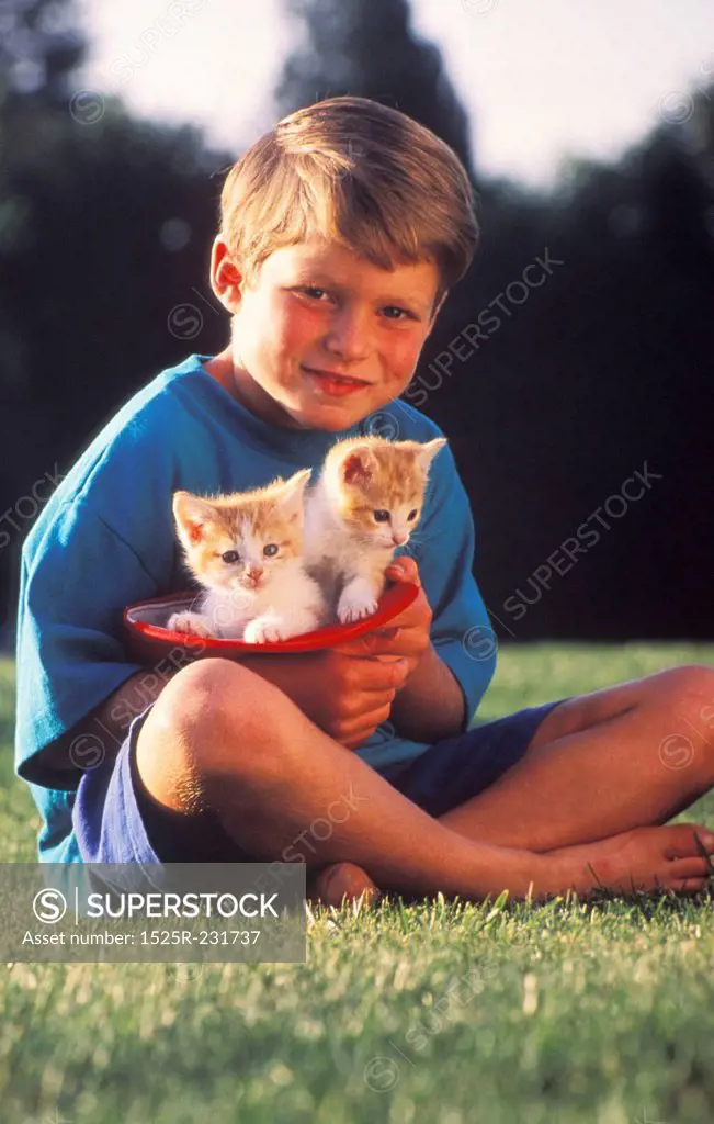 Little Boy Holding Kittens