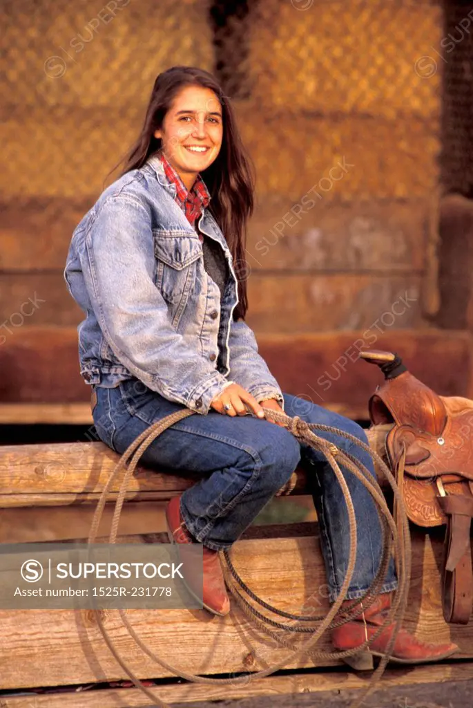 Woman Sitting with Saddle and Rope
