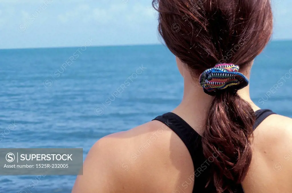 Woman About to Go Swimming in the Ocean