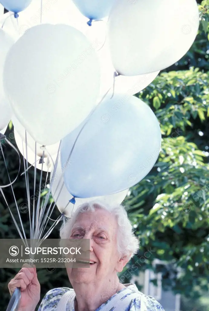 Old Lady Holding a Bunch of Balloons