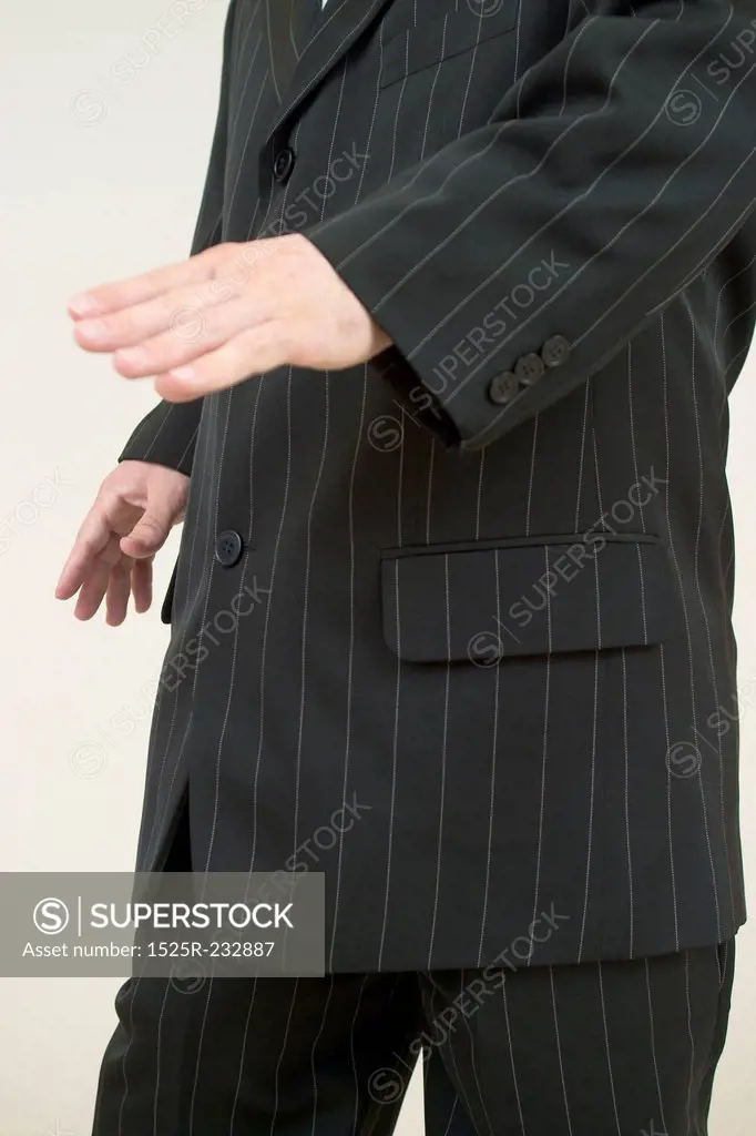 Sharply Dressed Man Gesturing With his Hands