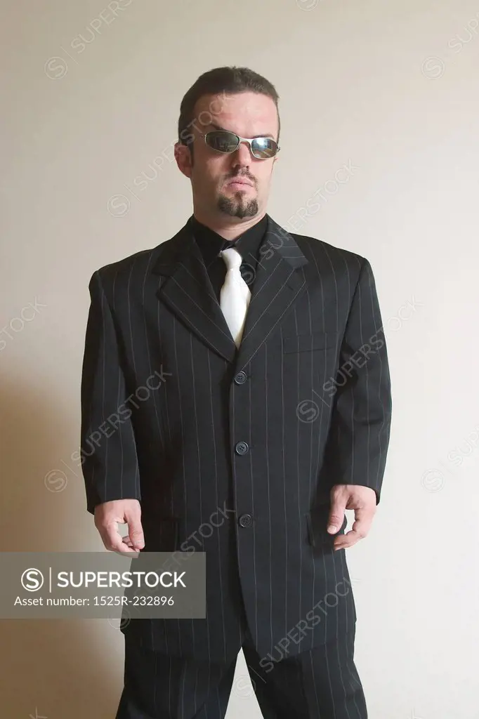 Sharply Dressed Man Wearing Intimidating Sunglasses