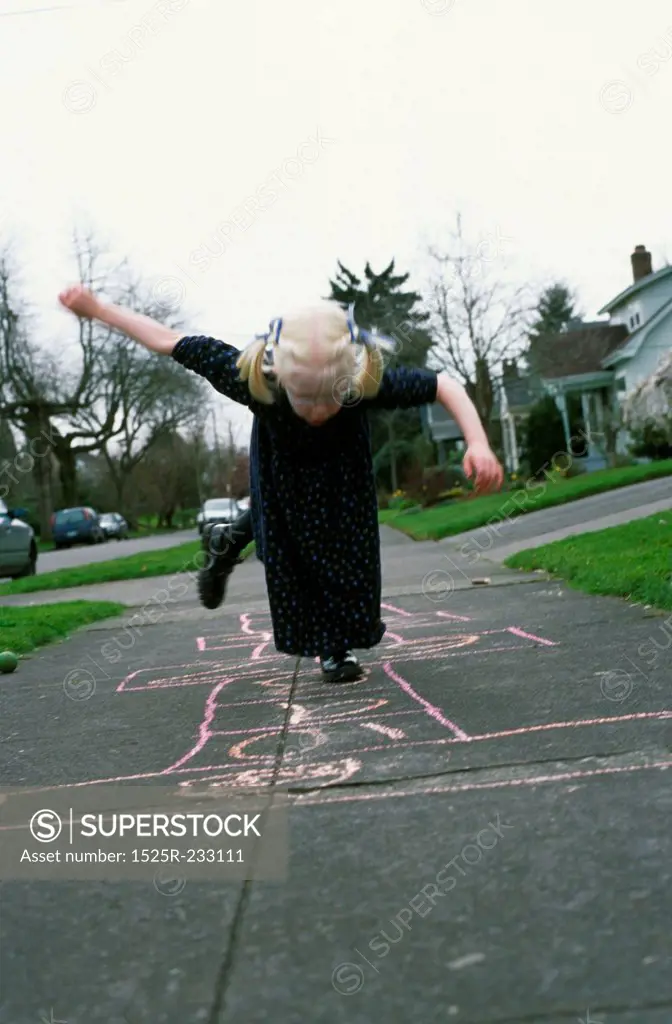Child Playing Hopscotch
