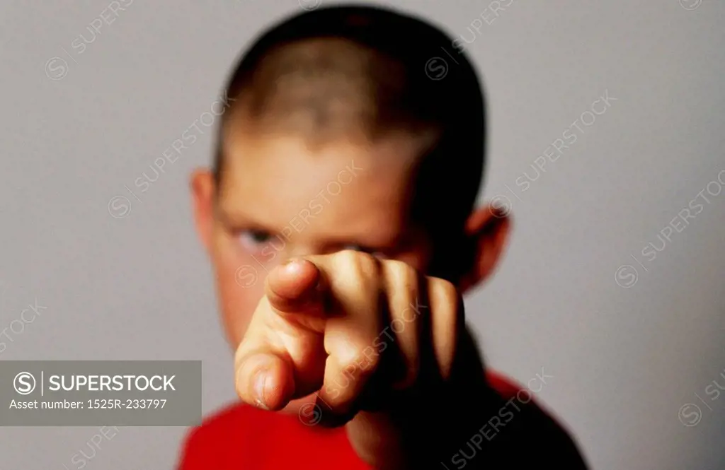 Boy Pointing Straight Ahead