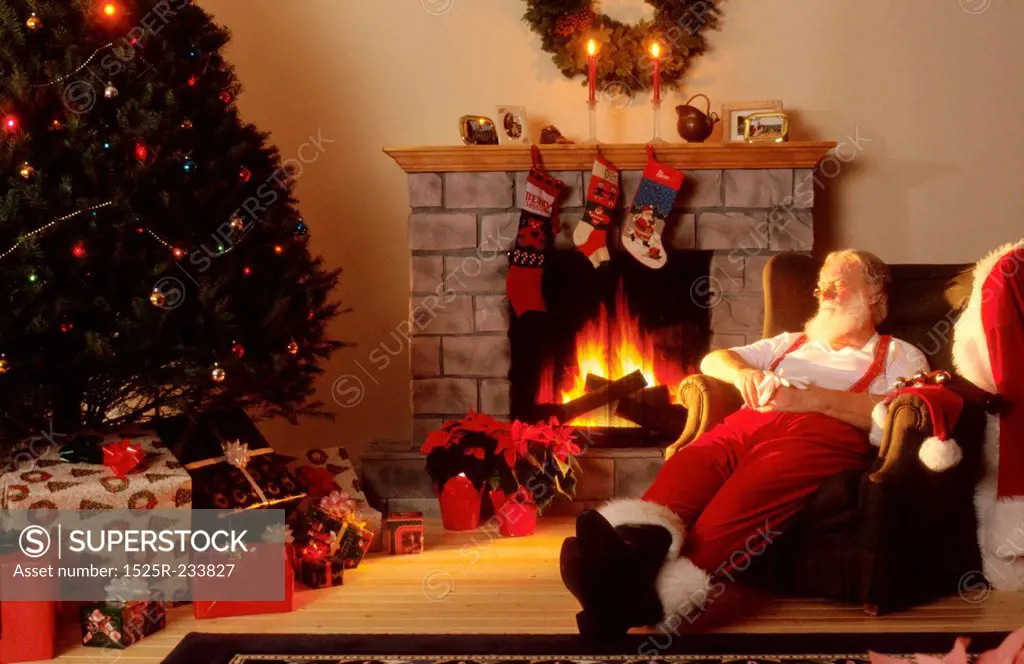 Santa Asleep by the Fireplace