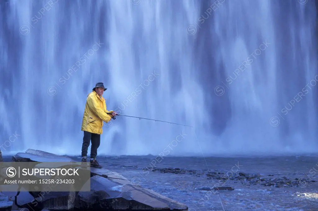 Man Fishing in Rainbow Falls