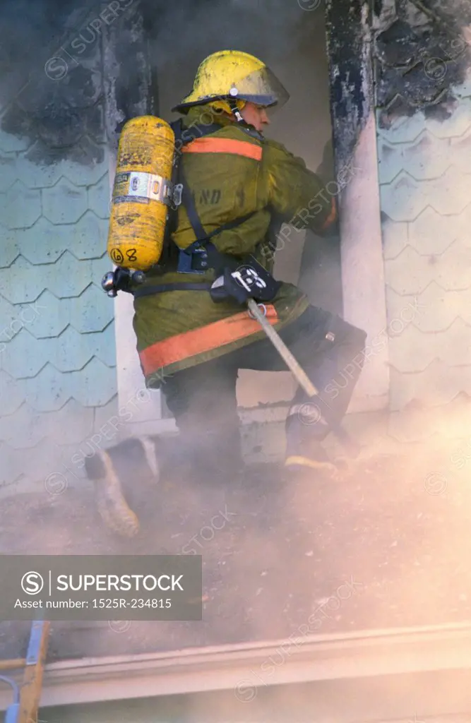 Fire Fighter on a Burning House